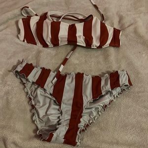 i’m selling this red and white striped 2 piece swimsuit.the swim suit is a small
